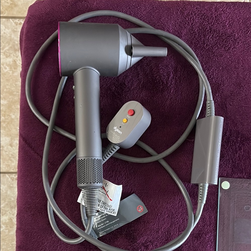 Gray Hair Dryer with Attachments (Dyson) works amazing